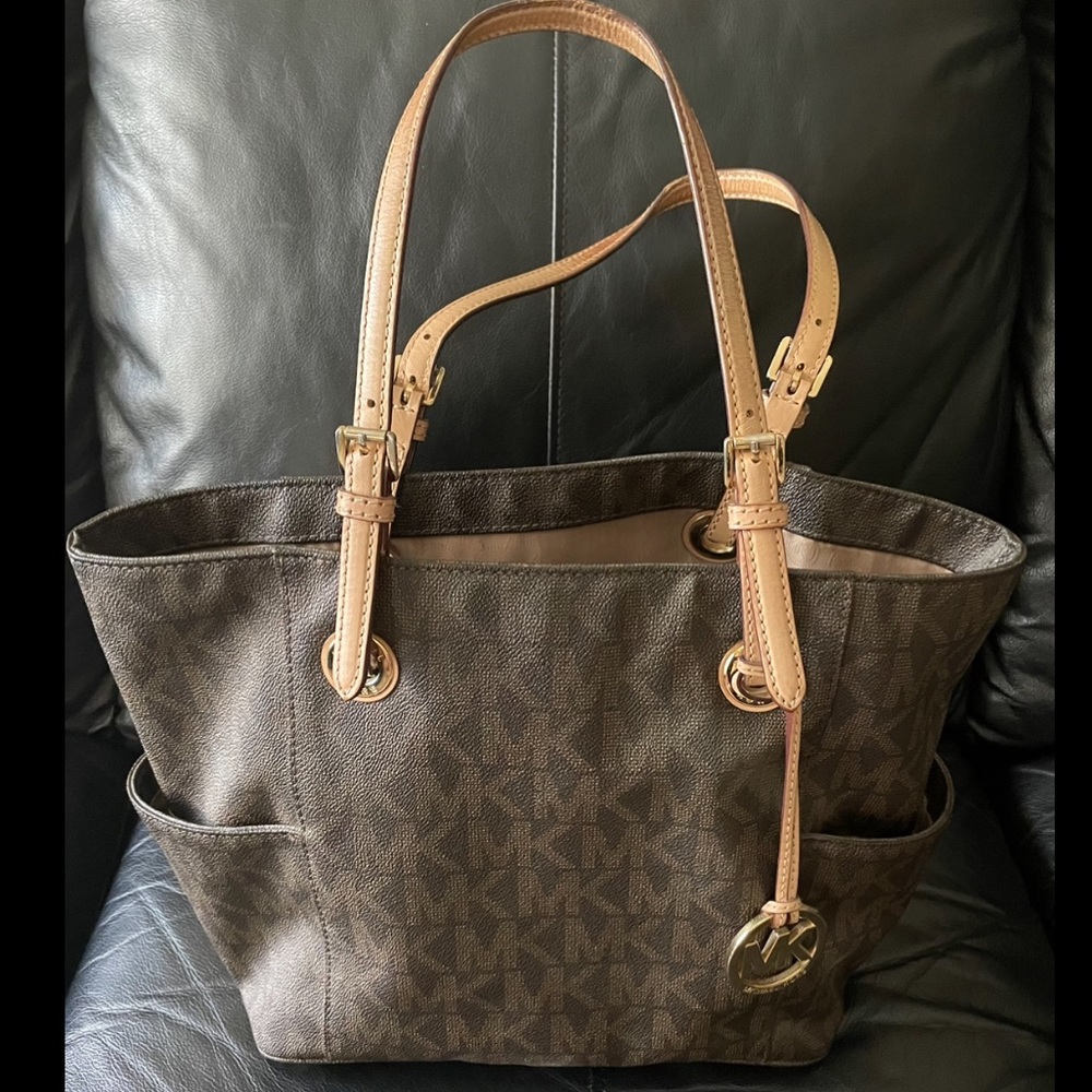 Michael Kors Tote. Used. Good condition. Some wear on handles- see photos.